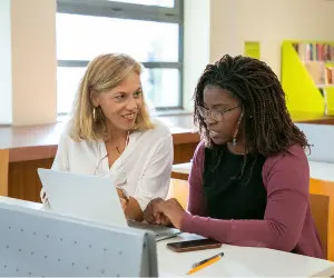Teacher preparing class with digital tools and printable worksheets